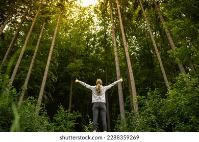 Young woman feeling alive feel good in nature	 - Powered by Shutterstock