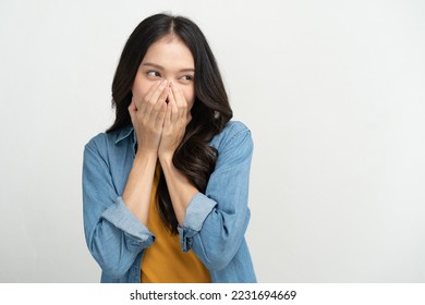 Young woman feeling embarrassed covering her face with her hands