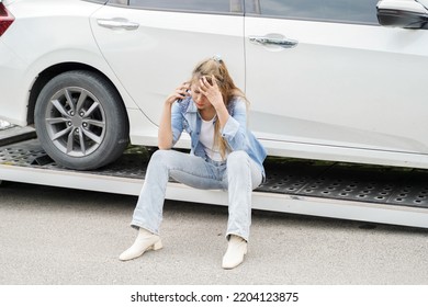 Young Woman Feeling Sad In The Damaged Car After A Car Accident, Use Mobile Phone Calling Insurance Company.