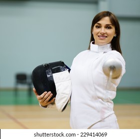 Young woman fencer with epee 