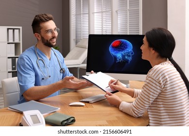 Young Woman Filling Form In Neurologist Office