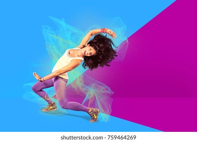 Young Woman At Fitness Exercise Or Zumba Dancing