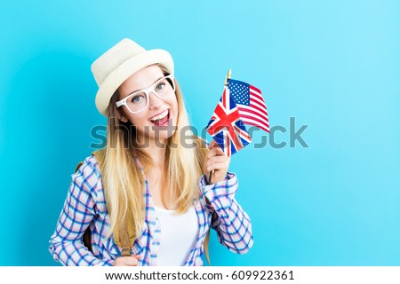 Young woman with flags of English speaking countries