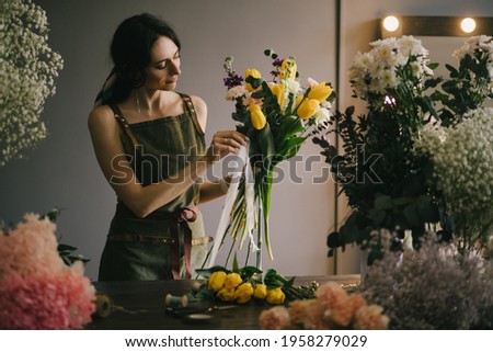 Similar – Foto Bild Floristin bindet einen bunten Strauß Blumen