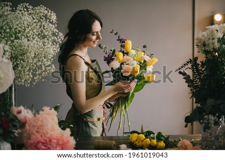 Similar – Foto Bild Floristin bindet einen bunten Strauß Blumen