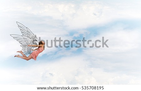 Young woman flying high in blue sky