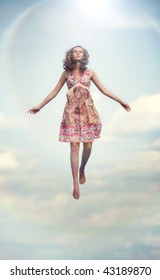 Young Woman Flying Up. Soft Colors.