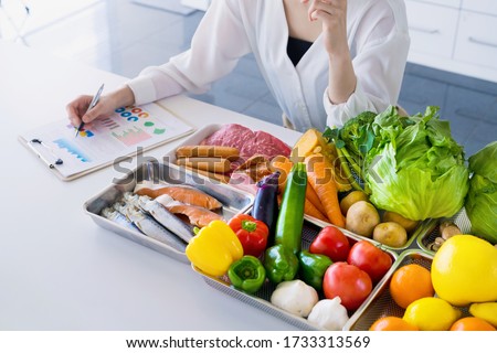 Young woman and foodstuff. Food coordinator. Nutritionist.