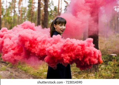 Young Woman In Forest Having Fun With Red Smoke Grenade, Bomb