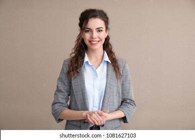 Young Woman In Formal Clothes On Color Background