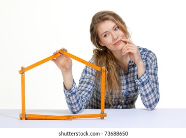 Young Woman Forms Meter Stick Into A House Shape