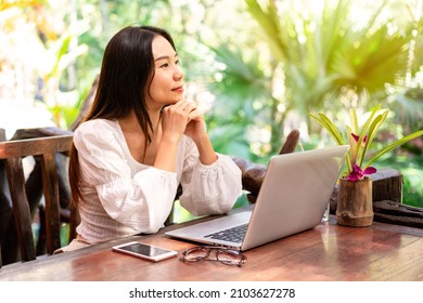 Young Woman Freelancer Traveler Working Online Using Laptop While Traveling On Vacation, Freelance Concept