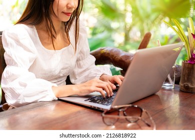 Young Woman Freelancer Traveler Working Online Using Laptop While Traveling On Vacation, Freelance And Workation Concept