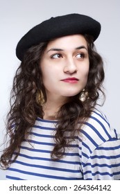 Young Woman With French Style Beret Hat And Striped T-shirt