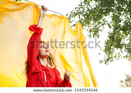 young woman in the fresh air in a beautiful manner model