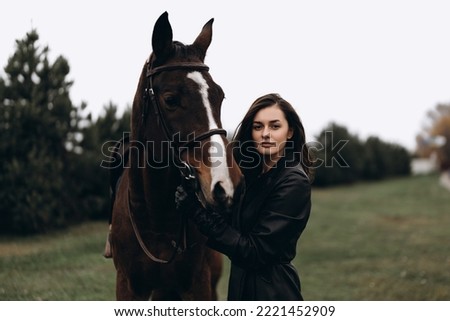A young woman and friendship with a horse. High quality photo