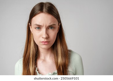 Young Woman With Frowning Expression in Portrait - Powered by Shutterstock