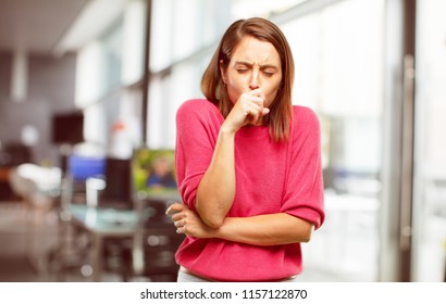 Young Woman Full Body. Coughing, Suffering A Winter Illness Such As A Cold Or The Flu, Feeling Unwell And Feverish.