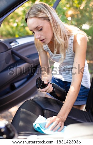 young woman furnishing the car interior