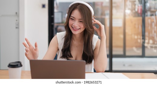 Young Woman Gammer Or Blogger Influencer Sit Looking At Camera Make Video Conference Call Recording Vlog In Living Room At Her Home.