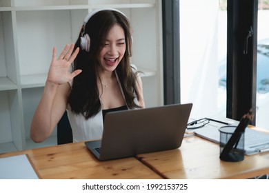 Young Woman Gammer Or Blogger Influencer Sit Looking At Camera Make Video Conference Call Recording Vlog In Living Room At Her Home.