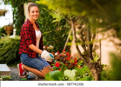 Young Woman Gardening In Summer