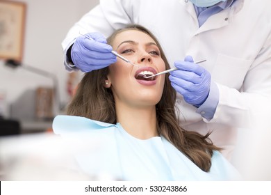 Young Woman Getting Dental Treatment