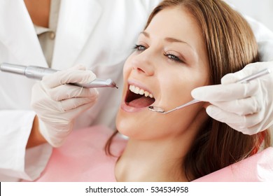 Young Woman Getting Dental Treatment. 