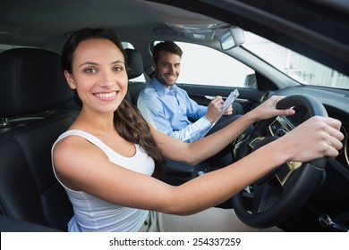 Young Woman Getting A Driving Lesson In The Car