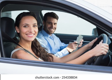 Young Woman Getting A Driving Lesson In The Car