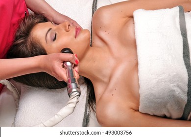 Young Woman Getting Face Radio Frequency Therapy Treatment In Beauty Center And Spa