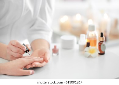 Young Woman Getting Manicure In Spa Salon