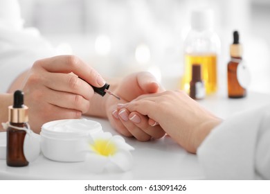 Young Woman Getting Manicure In Spa Salon