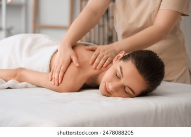 Young woman getting massage on couch in spa salon, closeup - Powered by Shutterstock