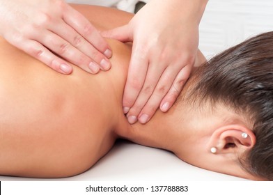 Young woman getting massage in massage salon. - Powered by Shutterstock