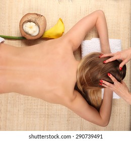 Young woman getting a massage in spa, studio