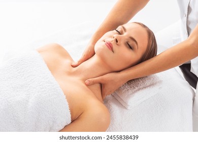 Young woman getting massaging treatment over white. Spa, healthcare and recreation concept. - Powered by Shutterstock