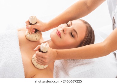 Young woman getting massaging treatment over white. Spa, healthcare and recreation concept. - Powered by Shutterstock