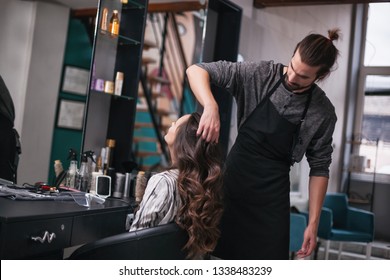 Young woman getting new hairstyle at professional hair styling saloon.  - Shutterstock ID 1338483239