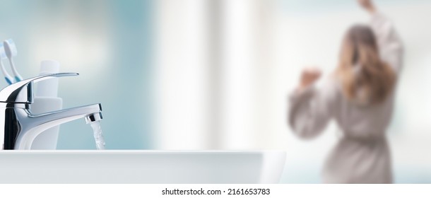 Young Woman Getting Ready In The Bathroom And Sink In The Foreground