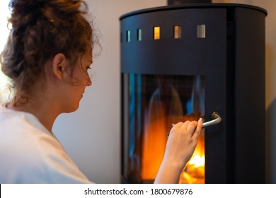 Young Woman Girl Closeup Opening Glass Door Of Rustic Vintage Country Home Fireplace In Cottage Cabin Small Adobe Fire Place