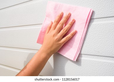 Young Woman Or Girl Hand Cleaning Garage Door Pvc