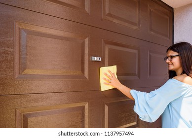 Young Woman Or Girl Hand Cleaning Garage Door Pvc
