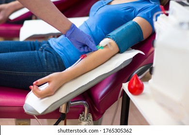 Young Woman Giving Blood In A Modern Hospital (color Toned Image)