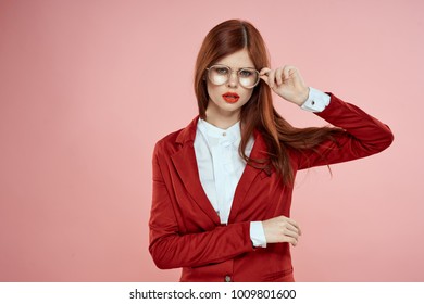   young woman with glasses on a pink background                              - Shutterstock ID 1009801600