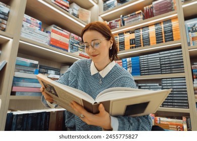 A young woman with glasses reads an interesting classic novel in a well-stocked cozy bookstore, surrounded by diverse literature genres. - Powered by Shutterstock