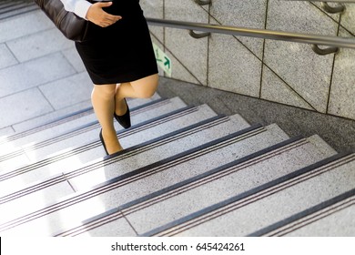 young woman going up the stairs front view.