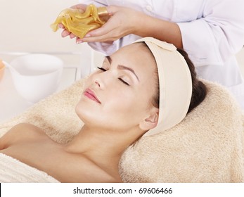 Young Woman With Gold Facial Mask.