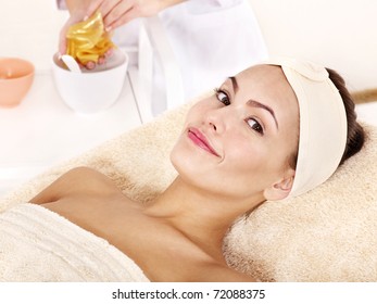 Young Woman With Gold Facial Mask.