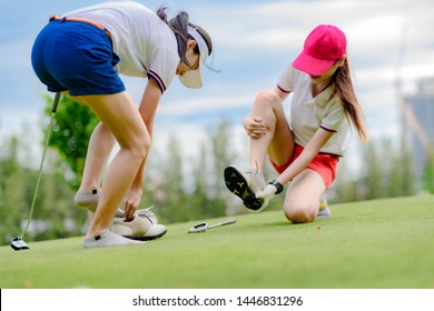 Young Woman Golf Player Feel Uncomfortable In Wear Of Shoe, Change Or Replace Active Shoe In The Golf Course, Dissatisfied Golf Shoe During Playing In Golf Course, Wearing Wrong Shoe